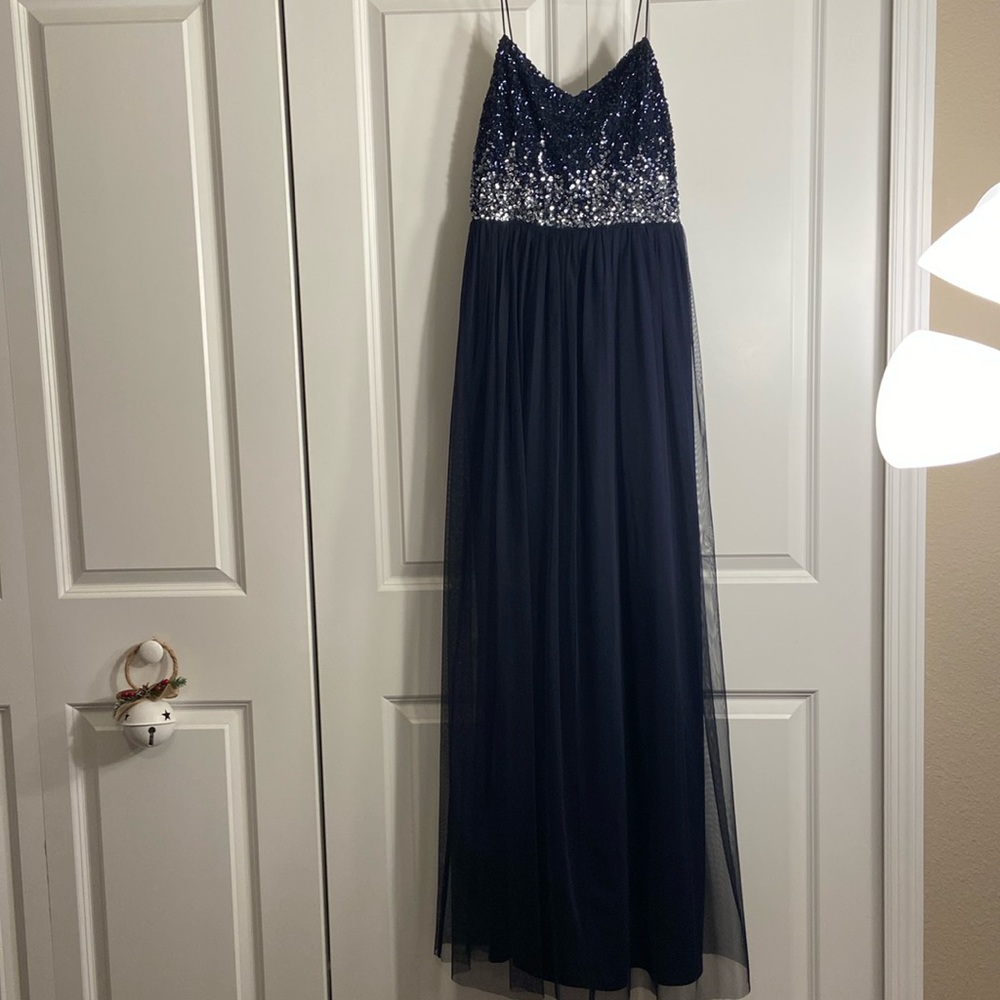 Navy blue and silver sequin on top, tulle material on lower half